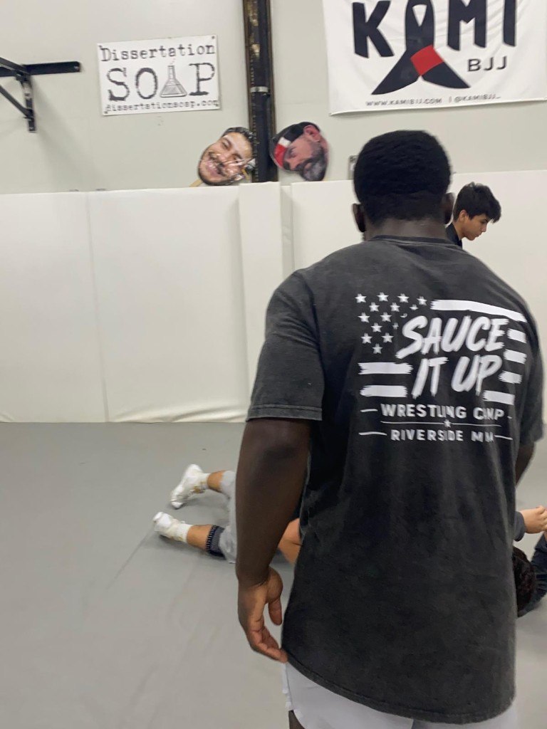 Coach Sauce leading wrestling camp practice